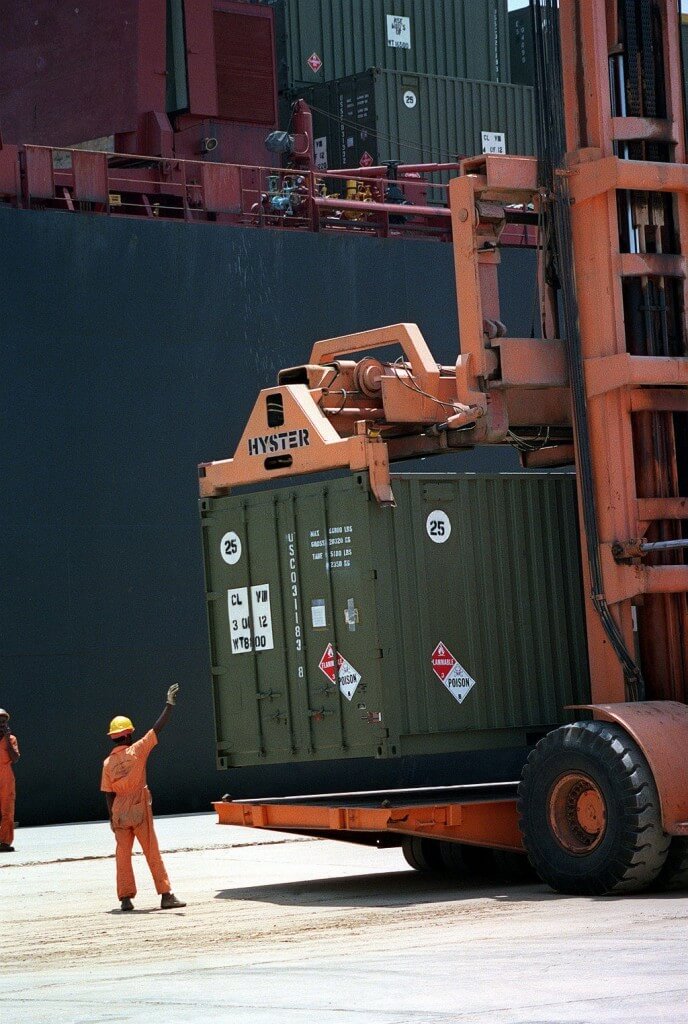 Dock Worker Guiding Container Lift Operator